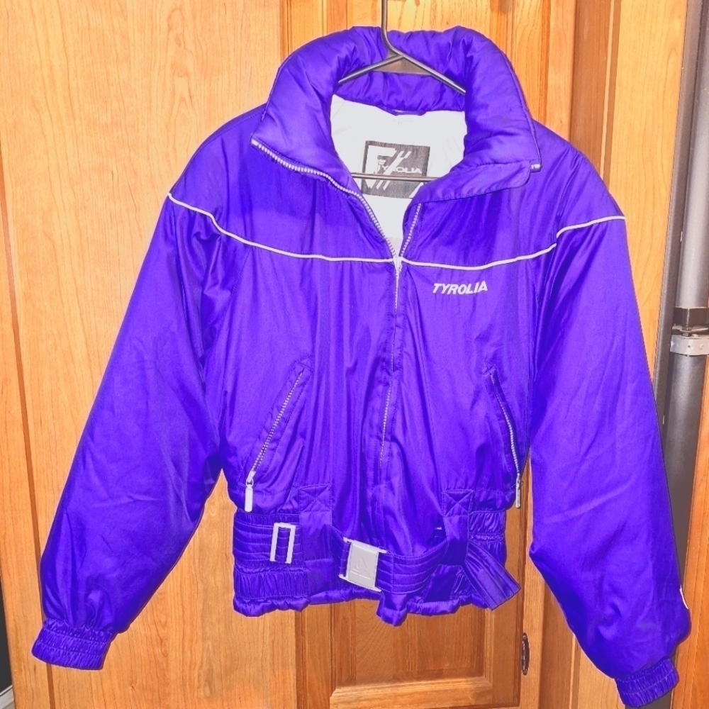 A Tyrolia women size 8 snow jacket in a blue color. It has adjustable waist. EUC